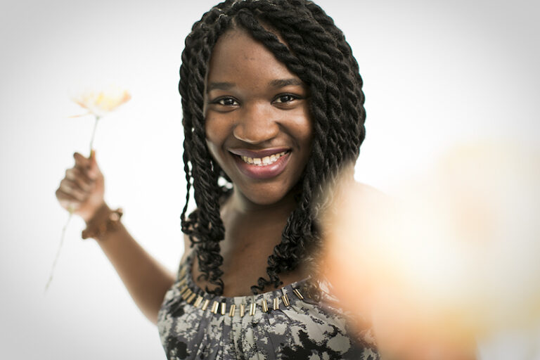 Headshot photograph of NC holding flowers